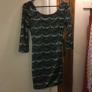 Gorgeous mini dress with open back and sleeves!